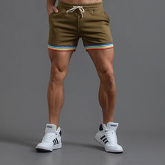 sexy gay man in dark armey green Men's Rainbow Gym Shorts with Pockets | Gay Shorts - Men's Activewear, gym short, sport shorts, running shorts- pridevoyageshop.com