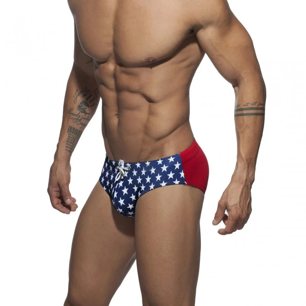 a hot gay man in blue Men's Bowtie Stars Swim Briefs - pridevoyageshop.com - gay men’s underwear and swimwear