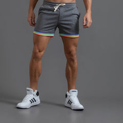 sexy gay man in dark gray Men's Rainbow Gym Shorts with Pockets | Gay Shorts - Men's Activewear, gym short, sport shorts, running shorts- pridevoyageshop.com