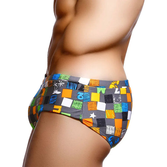 a hot gay man in Ocean Mosaic Swim Trunks - pridevoyageshop.com - gay men’s underwear and swimwear