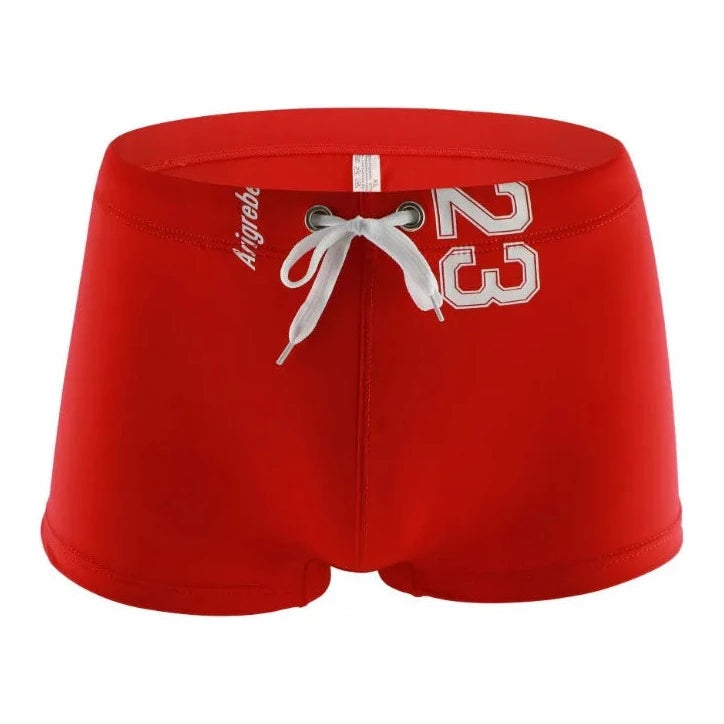 red Men's 23 Bowtie Swim Trunks - pridevoyageshop.com - gay men’s underwear and swimwear
