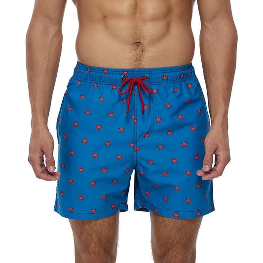 a hot gay man in blue Crabs Board Shorts - pridevoyageshop.com - gay men’s underwear and swimwear