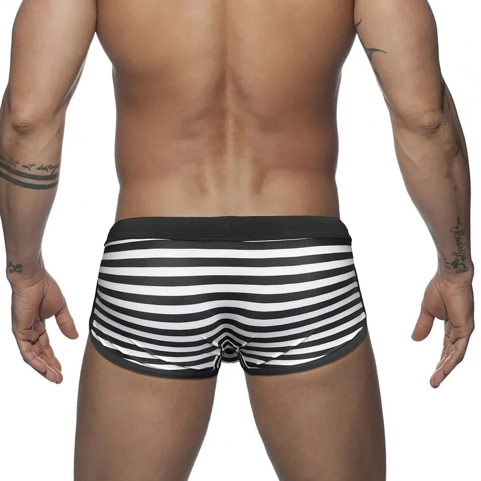 a hot gay man in black Mariner Stripe Swim Trunks - pridevoyageshop.com - gay men’s underwear and swimwear
