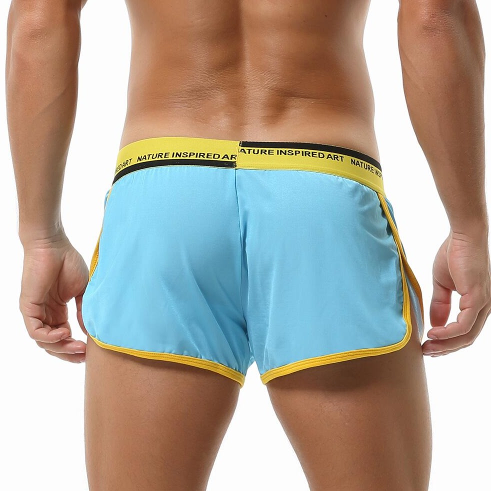hot gay man in light blue Seobean Mens Gym Shorts With Built In Jockstrap | Gay Shorts - Men's Activewear, gym short, sport shorts, running shorts- pridevoyageshop.com