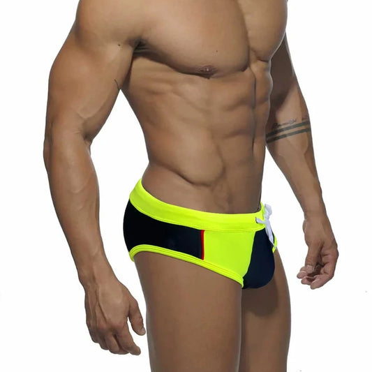 a sexy gay man in yellow Men's Patchwork Bowtie Swim Briefs - pridevoyageshop.com - gay men’s underwear and swimwear