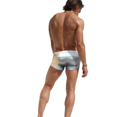 a sexy gay man in silver Men's Liquid Metallic Swim Trunks - pridevoyageshop.com - gay men’s underwear and swimwear