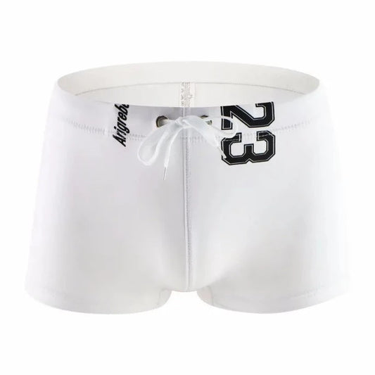 white Men's 23 Bowtie Swim Trunks - pridevoyageshop.com - gay men’s underwear and swimwear