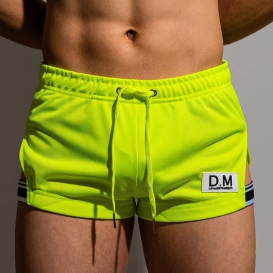 sexy gay man in Fluorescent Green Gay Shorts | DM Side Show Gym Shorts - Men's Activewear, gym short, sport shorts, running shorts- pridevoyageshop.com