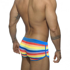 a hot gay man in Rainbow Striped Mesh Square Cut Swim Trunks - pridevoyageshop.com - gay men’s underwear and swimwear