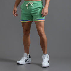 sexy gay man in green Men's Rainbow Gym Shorts with Pockets | Gay Shorts - Men's Activewear, gym short, sport shorts, running shorts- pridevoyageshop.com