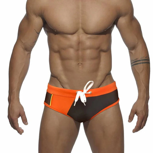 a sexy gay man in orange Men's Patchwork Bowtie Swim Briefs - pridevoyageshop.com - gay men’s underwear and swimwear