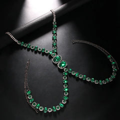 a flat lay of Gunmetal Emerald City Showgirl Gem Harness - pridevoyageshop.com - gay men's harness, fetish gear, rave outfit