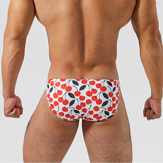 a hot man in Men’s Cherry Poppin’ Swim Briefs - pridevoyageshop.com - gay men’s sexy swim briefs, trunks, board shorts, and bikinis