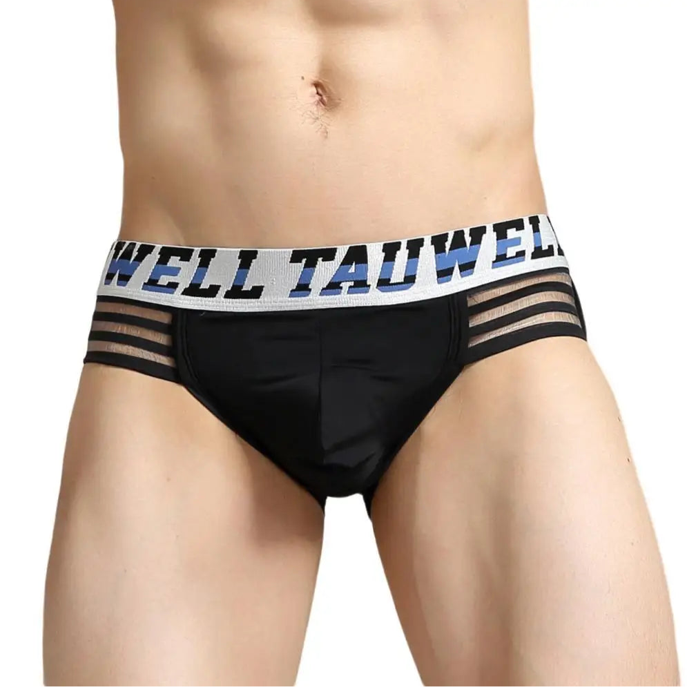 a hot man in black TAUWELL Men’s “Strap & Sizzle” Low-Rise Brief - pridevoyageshop.com - gay men’s thongs, boxers, briefs and jockstraps