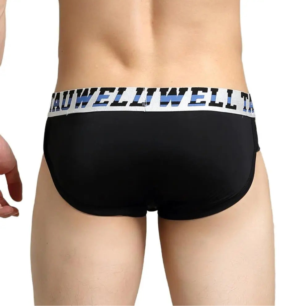 a hot man in black TAUWELL Men’s “Strap & Sizzle” Low-Rise Brief - pridevoyageshop.com - gay men’s thongs, boxers, briefs and jockstraps