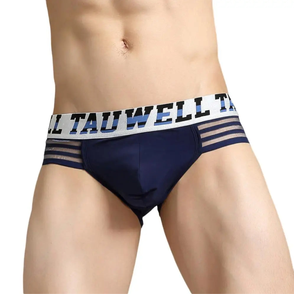 a hot man in dark blue TAUWELL Men’s “Strap & Sizzle” Low-Rise Brief - pridevoyageshop.com - gay men’s thongs, boxers, briefs and jockstraps