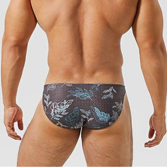 a sexy man inMen’s Midnight Jungle Jock Bikini Swim Briefs - pridevoyageshop.com - gay men’s sexy swim briefs, trunks, board shorts, and bikinis