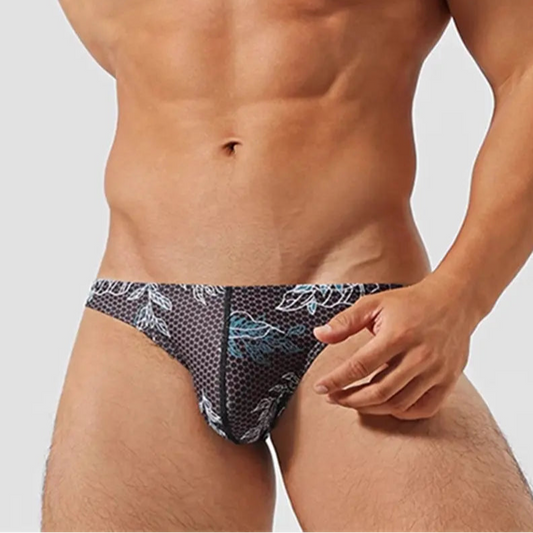 a sexy man inMen’s Midnight Jungle Jock Bikini Swim Briefs - pridevoyageshop.com - gay men’s sexy swim briefs, trunks, board shorts, and bikinis