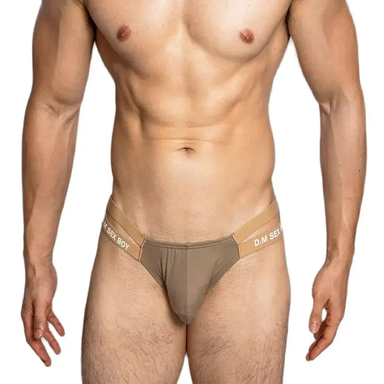 a sexy man in Champagne DM Men’s “Sex Boy” Side-Strap Brief - pridevoyageshop.com - gay men’s thongs, boxers, briefs and jockstraps