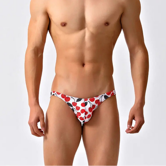 a sexy man in Cherry Tease Men’s Red Light Marina Mesh Bikini Swim Briefs - pridevoyageshop.com - gay men’s sexy swim briefs, trunks, board shorts, and bikinis
