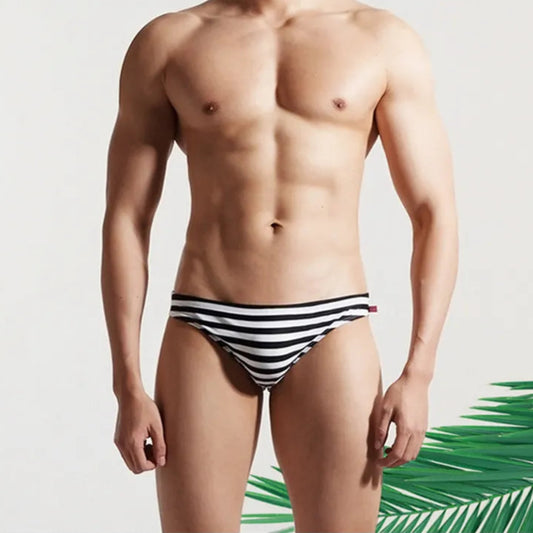 a sexy man in Desmiit Men’s Cellblock Sweetheart Low Rise Swim Briefs - pridevoyageshop.com - gay men’s sexy swim briefs, trunks, board shorts, and bikinis