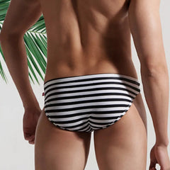 a sexy man in Desmiit Men’s Cellblock Sweetheart Low Rise Swim Briefs - pridevoyageshop.com - gay men’s sexy swim briefs, trunks, board shorts, and bikinis
