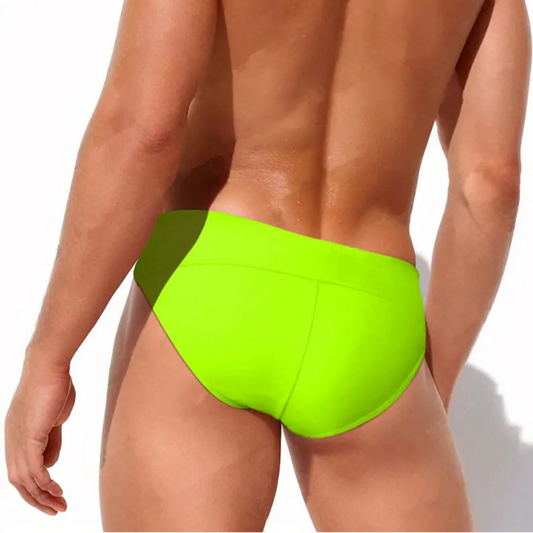 a sexy man in Fluorescent Green Men's Flesh and Summer Side Tether Swim Brief - pridevoyageshop.com - gay men’s sexy swim briefs, trunks, board shorts, and bikinis