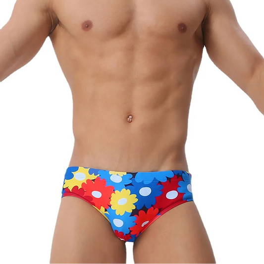 a sexy man in Men’s Bloom & Bust Swim Briefs - pridevoyageshop.com - gay men’s sexy swim briefs, trunks, board shorts, and bikinis