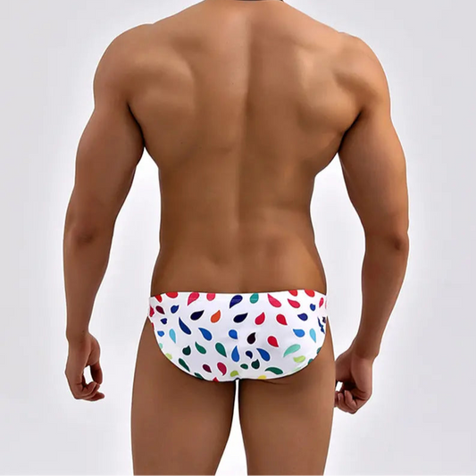 a sexy man in Men’s Drippin’ Desire Swim Briefs - pridevoyageshop.com - gay men’s sexy swim briefs, trunks, board shorts, and bikinis