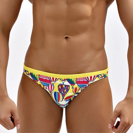 a sexy man in Men’s High-Flyer Bulge Swim Briefs - pridevoyageshop.com - gay men’s sexy swim briefs, trunks, board shorts, and bikinis