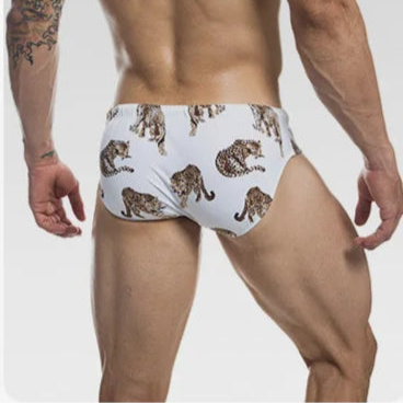a sexy man in Men's Leopard Prowl Swim Briefs - pridevoyageshop.com - gay men’s sexy swim briefs, trunks, board shorts, and bikinis