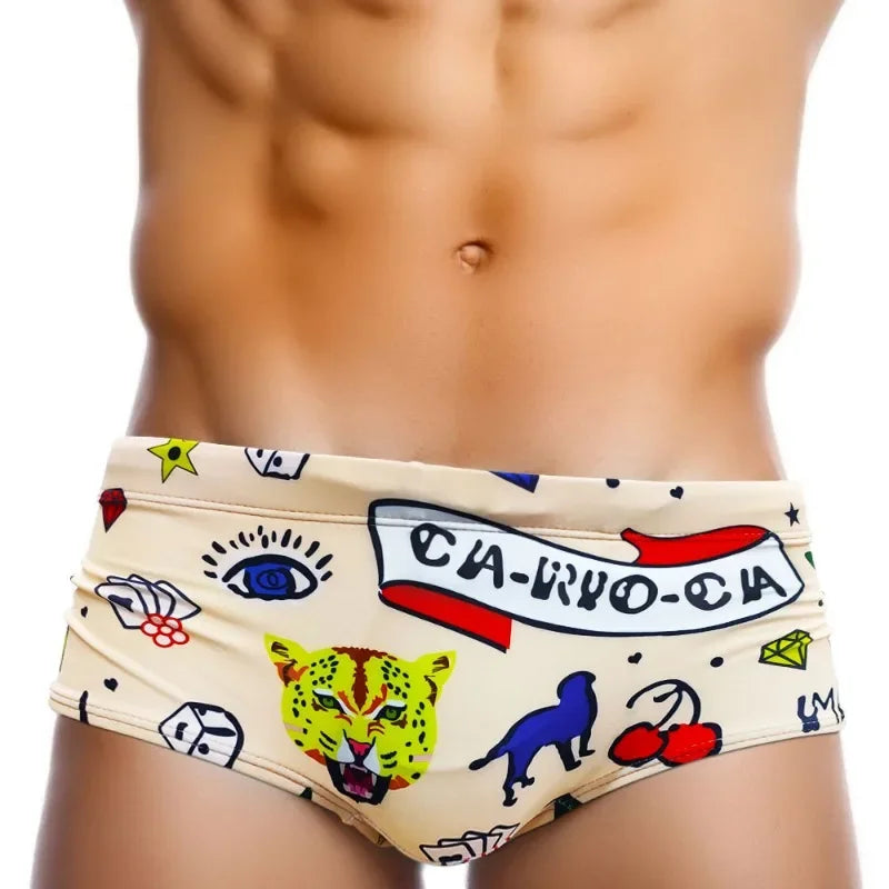 a sexy man in Men’s Lust & Luck Low Rise Swim Trunks - pridevoyageshop.com - gay men’s sexy swim briefs, trunks, board shorts, and bikinis