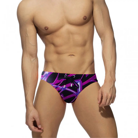 a sexy man in Men’s Neon Veins Swim Briefs - pridevoyageshop.com - gay men’s sexy swim briefs, trunks, board shorts, and bikinis