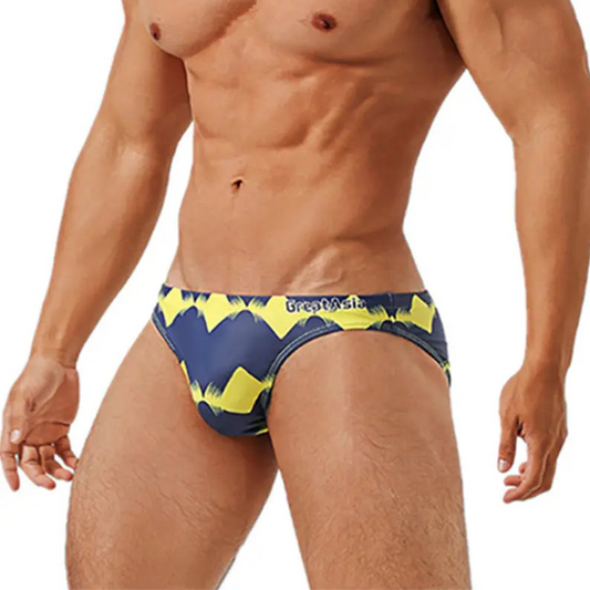 a sexy man in Men’s Neon Voltage Bikini Swim Briefs - pridevoyageshop.com - gay men’s sexy swim briefs, trunks, board shorts, and bikinis