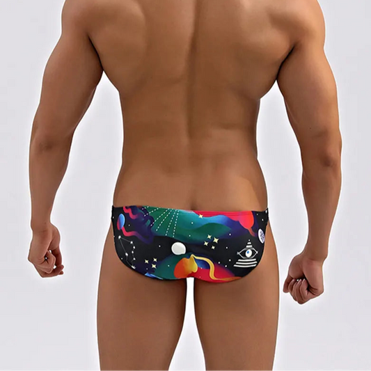 a sexy man in Men’s Orbit My Ass Bikini Swim Briefs - pridevoyageshop.com - gay men’s sexy swim briefs, trunks, board shorts, and bikinis