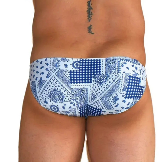 a sexy man in Men’s Patch Me Up Micro Bikini Swim Briefs - pridevoyageshop.com - gay men’s sexy swim briefs, trunks, board shorts, and bikinis