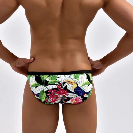 a sexy man in Men’s Peck Me Paradise Swim Briefs - pridevoyageshop.com - gay men’s sexy swim briefs, trunks, board shorts, and bikinis