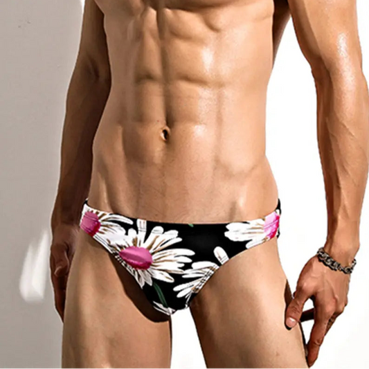 a sexy man in Men’s Plow My Daisies Bikini Swim Briefs - pridevoyageshop.com - gay men’s sexy swim briefs, trunks, board shorts, and bikinis