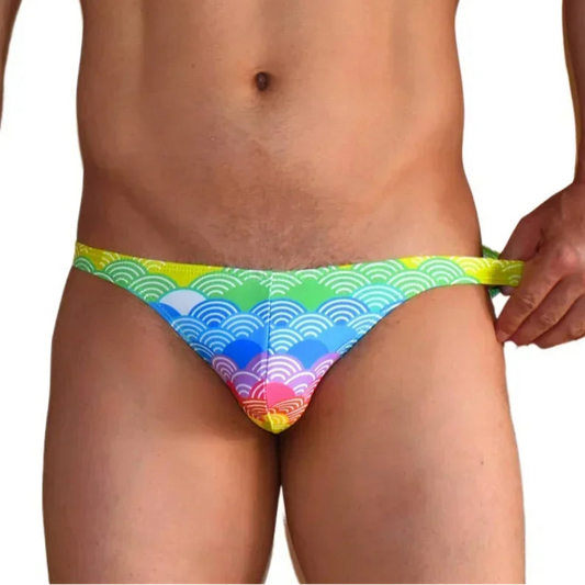 a sexy man in Men’s Poolboy Rainbow Swim Briefs - pridevoyageshop.com - gay men’s sexy swim briefs, trunks, board shorts, and bikinis
