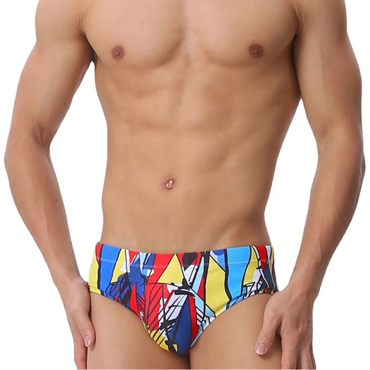 a sexy man in Men’s Pop Prism Swim Briefs - pridevoyageshop.com - gay men’s sexy swim briefs, trunks, board shorts, and bikinis