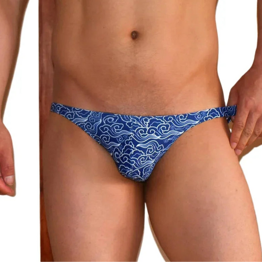 a sexy man in Men’s Ride the Wave Bikini Swim Briefs - pridevoyageshop.com - gay men’s sexy swim briefs, trunks, board shorts, and bikinis