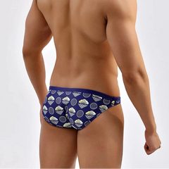 a sexy man in Men’s Shell Shock Swim Bikini Briefs - pridevoyageshop.com - gay men’s sexy swim briefs, trunks, board shorts, and bikinis