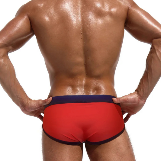a sexy man in Men’s Star-Spangled Swim Briefs - pridevoyageshop.com - gay men’s sexy swim briefs, trunks, board shorts, and bikinis