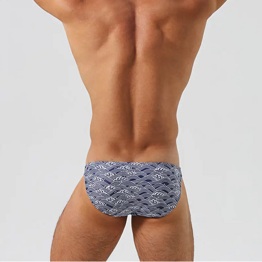 a sexy man in Men’s Tidal Tease Swim Briefs - pridevoyageshop.com - gay men’s sexy swim briefs, trunks, board shorts, and bikinis