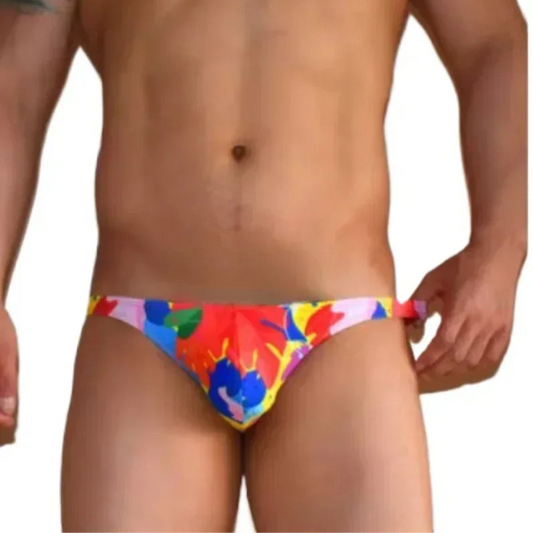 a sexy man in Men’s Tropical Blaze Swim Bikini Briefs - pridevoyageshop.com - gay men’s sexy swim briefs, trunks, board shorts, and bikinis