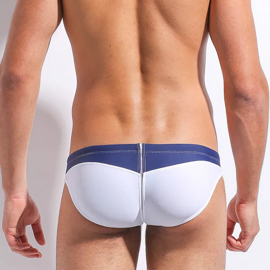 a sexy man in Men’s Varsity Victory Swim Briefs - pridevoyageshop.com - gay men’s sexy swim briefs, trunks, board shorts, and bikinis