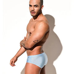 a sexy man in light blue Desmiit Men’s Pouch Devil Low Rise Swim Briefs - pridevoyageshop.com - gay men’s sexy swim briefs, trunks, board shorts, and bikinis