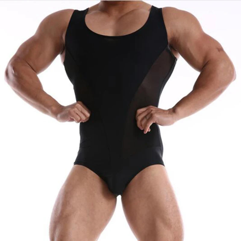 a sexy man in black Adonis V-Contour Mesh Singlet, see-through tight mesh, bold V-cut chest frame, dominant athletic kink look – pridevoyageshop.com – gay men’s harness, lingerie and fetish wear