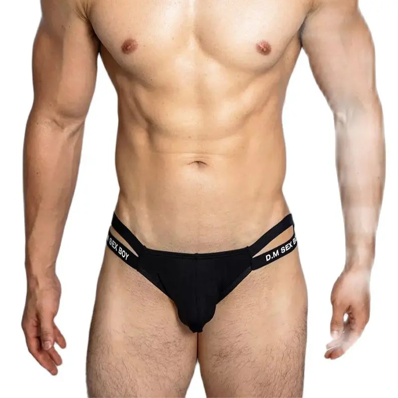 a sexy man in black DM Men’s “Sex Boy” Side-Strap Brief - pridevoyageshop.com - gay men’s thongs, boxers, briefs and jockstraps