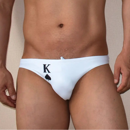 a sexy man in black K Men’s Strip Poker Swim Briefs - pridevoyageshop.com - gay men’s sexy swim briefs, trunks, board shorts, and bikinis